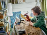 Child playing with LEGO Battle Droid and STAP.