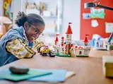 Child playing with the LEGO castle set.