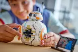 Child opening BB-8's panel.
