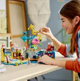 Child playing with amusement park set.