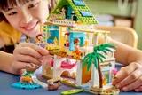 Child's hands exploring the Beach House interior.