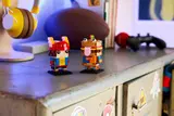 BrickHeadz on a gaming desk.