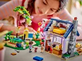 Girl playing with LEGO Friends set.