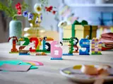 LEGO animal numbers (0-9) displayed on a party table.