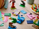 LEGO bricks and partially built animal numbers on a table.