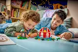 Father and child building LEGO.