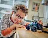 Child playing with truck.