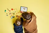 Building LEGO Bluey with digital instructions.