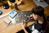 Person building LEGO BMW M3 (E30).
