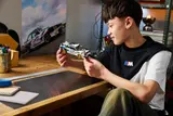 Person admiring LEGO BMW M3 (E30).