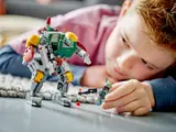 Child playing with standing mech and minifigure.