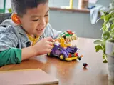 Child playing with Bowser car and bombs.