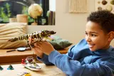 Child playing with LEGO Mosasaurus.