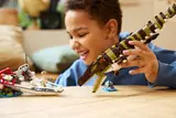 Child playing Mosasaurus attacking LEGO boat.