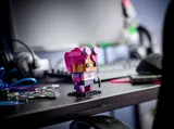 Brite Bomber BrickHeadz on a gamer's desk.