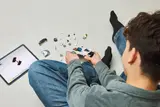 Building LEGO Bugatti with digital instructions.