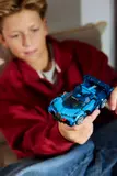 Child holding Bugatti Vision GT.