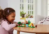 Child playing with LEGO Animal Crossing.