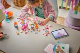 Child playing with LEGO Friends set.