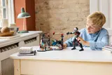 Child plays with LEGO Civil War set.