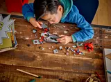 Child disassembling LEGO 76292.