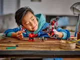 Child playing with LEGO 76292.