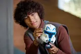 Builder adjusting Captain Rex Helmet.