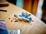 Completed Y-Wing and accessories on desk.