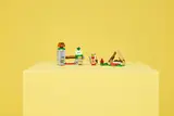 Child playing with LEGO Captain Toad.