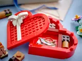 Close-up of heart box holding a ring.