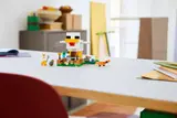 LEGO Chicken Farm set on a desk.