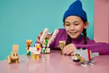 Child interacting with LEGO Minecraft.