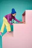 Child playing on multi-level terrain.