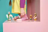 Child's foot next to Minecraft figures.