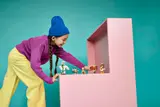 Child playing with Minecraft figures.