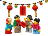 Minifigures under festive lanterns.