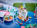 LEGO Christmas house with scattered elements.