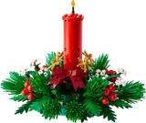 LEGO Christmas candle decoration with festive foliage.
