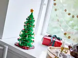 LEGO Christmas tree on a bright windowsill.