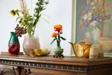 Chrysanthemum on a wooden cabinet.