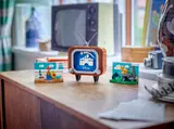 Disney TV and scenes on a table.