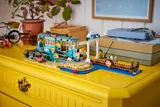 LEGO streetcar set displayed on a yellow dresser.