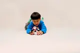 Child playing with mech.