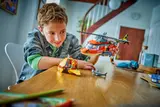 Boy playing with set.