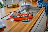 LEGO Coast Guard boat on kitchen counter.