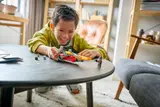 Child playing with set.