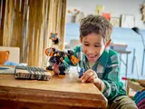 Child playing with Earth Mech