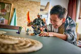 Child playing with Ninjago set.