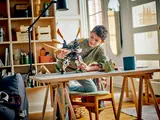 Child playing with mech.