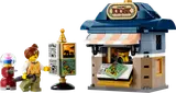 LEGO Corner Kiosk set with minifigure and accessories.